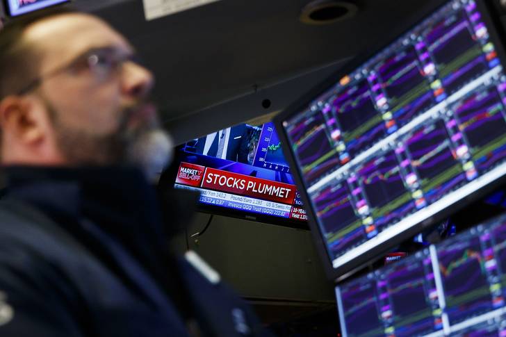 Traders work on the floor of the New York Stock Exchange. Stocks around the world are broadly lower as investors are reportedly reacting to news that the coronavirus is spreading to more countries.